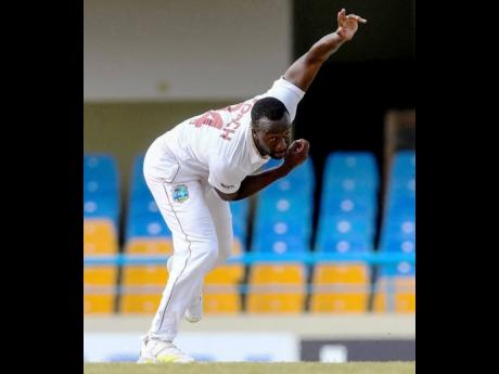 Kemar Roach of the West Indies bowling during the third day of the first Test against Bangladesh at Vivian Richards Cricket Stadium in North Sound, Antigua and Barbuda, on June 18, 2022. 