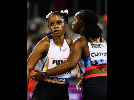 Credit: Courtesy of @diamondleagueathletics/IG Tia Clayton (left) is congratulated by her twin Tina after the former won the women’s 100 metres at the Doha Diamond League in Qatar.