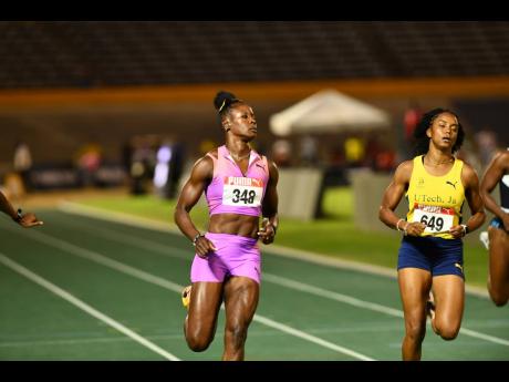Credit: Matthew McKoy Shericka Jackson (left) of MVP Track & Field Club winning her heat.