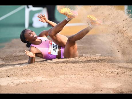 Credit: Matthew McKoy Photos Ackelia Smith winning the women’s long jump yesterday at the JAAA National Junior and Senior Championships at the National Stadium.