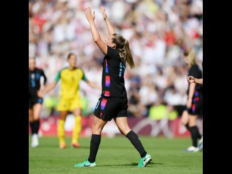 England’s Ella Toone celebrates after scoring against Jamaica in a friendly international football match yesterday at the King Power Stadium. England won 7-0.