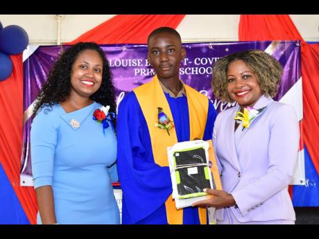 Credit: Contributed Minister of Education, Skills, Youth and Information, Senator Dr Dana Morris Dixon (right), presents a tablet to Chadrick Bailey (centre), the most improved student at Louise Bennett-Coverley Primary School, at the recent graduation ceremony held at the school campus in Gordon Town, St Andrew. Sharing the moment is Sheena Taylor Morgan, the school principal.