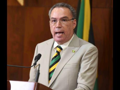 Energy Minister Daryl Vaz addresses the media yesterday at Jamaica House.