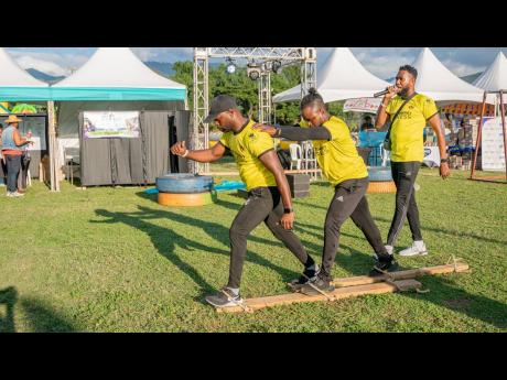 A test of balance, coordination and team synergy during the obstacle course at FitFest.