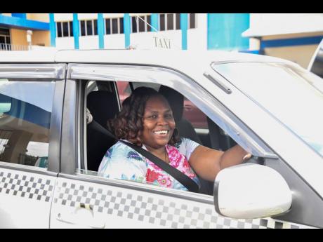 Credit: Photos by Matthew McKoy/Photographer Elaine Jackson navigates Kingston’s chaos with grace and wisdom.