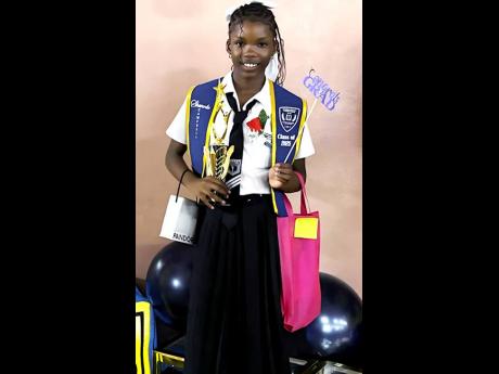 Top Girl at the Maverley Primary and Infant School, Shanoya Campbell, who will be going to Merl Grove High School this September, displays her trophies and gifts at the institution recently.