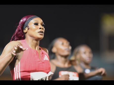 Credit: Ian Allen/Photographer Ashanti Moore (left) wins the women’s 200 metres during the recent JAAA National Senior and Junior Championships at the National Stadium.