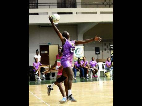 Credit: Ian Allen/Photographer Tracyann Francis (right) of Kingston Hummingbirds catches a pass while being pressured by Dhanyel Johnson of St Ann Orchids during Netball Jamaica’s Red Stripe Flavours Elite League semi-final match inside the National Arena on Friday. Francis was named MVP of last night’s final.
