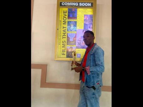 Credit: Contributed Writer and director for the award-winning short film, ‘Amara the Immortal,’ Cornelius Grant, shows off award at the Films That Move festival.