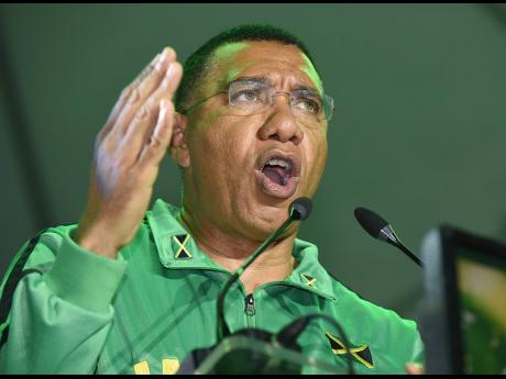 Credit: Ian Allen Prime Minister Dr Andrew Holness addressing the JLP mass rally in Half-Way Tree on Sunday.