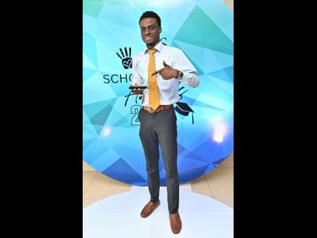 Credit: Rudolph Brown James Barrett, the Sagicor Foundation’s Chairman’s Innovation awardee, celebrates his win at the entity’s scholarship awards ceremony at The Jamaica Pegasus hotel in New Kingston yesterday.