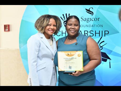 Credit: Rudolph Brown Education Minister Senator Dr Dana Morris Dixon (left), with Calicia Vassell, winner of the R Danny Williams Visionary Awardee for leadership and volunteerism.