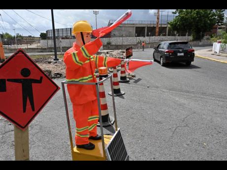 Credit: Rudolph Brown The robot flagman on Collie Smith Drive.
