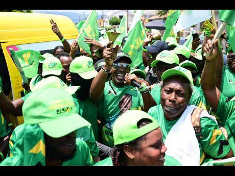 JLP candidate for St Catherine East Central, Alando Terrelonge (centre), is swarmed by supporters.