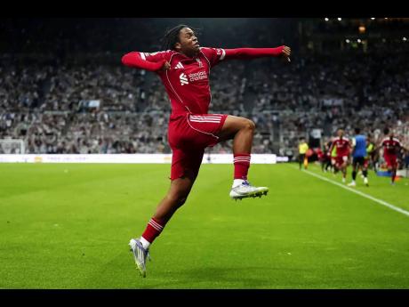 Liverpool’s Rio Ngumoha celebrates after scoring his side’s third goal during the English Premier League soccer match against Newcastle United at St. James’ Park, Newcastle, England, yesterday. Liverpool won 3-2.