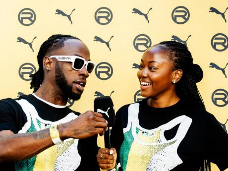 Credit: Contributed Jamaican rapper Stylo G (left) giving a brief interview ahead of his performance at the Notting Hill Carnival on Sunday.