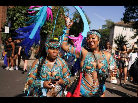Credit: AP People sing and dance to celebrate Notting Hill Carnival in London, on Monday, Europe’s biggest street party and one of the largest carnivals in the world.
