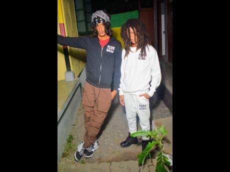 Brothers Iyah Knife (left), a vegan food chef, and Kambon, a visual artist, proudly wear designs from their mother’s collection, Tuff Like Iron.