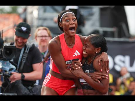 Credit: Grand Slam Track Ackera Nugent (left) celebrating with Megan Tapper