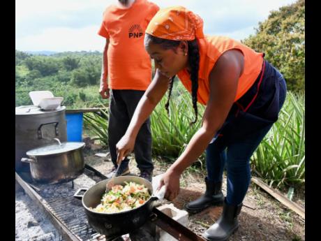 Nekeisha Burchell, People’s National Party’s candidate for South St James, prepares her saltfish dish.
