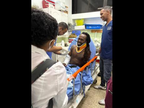 Credit: Contributed Reggae star Jesse Royal managed a brave smile from his hospital bed as he received treatment following a recent car accident.