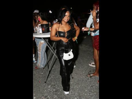 Pashanna Thomas, payroll officer, stuns in a full black leather outfit.