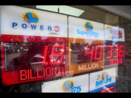 An electronic sign reads $1.8 billion as crowds wait in line to buy lottery tickets at the Bluebird Liquor store in Hawthorne, California, on Friday, September 5, 2025. 