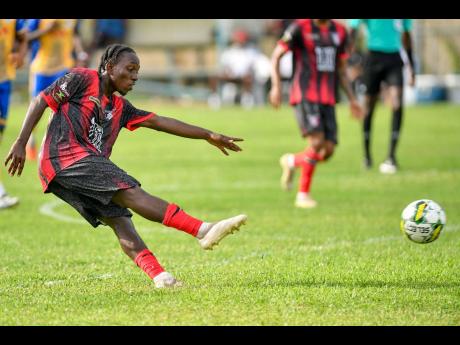 Credit: Matthew McKoy Tarique Jones of Arnett Gardens FC shoots to score the third goal for his team during the Jamaica Premier League football match against Harbour View Football Club at Drewsland Mini Stadium yesterday. Arnett Gardens FC won 5-2.