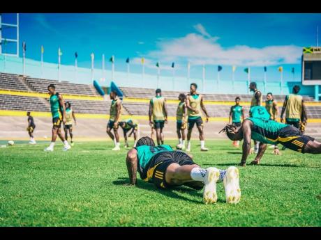 Jamaica’s Reggae Boyz warming up for the final time ahead of their Concacaf World Cup Qualifying football clash against Trinidad and Tobago at the National Stadium today.