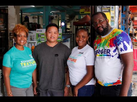 Credit: Contributed Ryan Chung (second left), managing director of Wilson Chung Hardware, is flanked by Berger Paints Jamaica representatives — Jody-Ann Jones (left), area sales manager – Eastern; Tamara Thomas (second right), trade marketing officer; and Ahmad Fitzgerald, sales associate — at the final leg of the Trowel-On Roadshow in St Thomas.