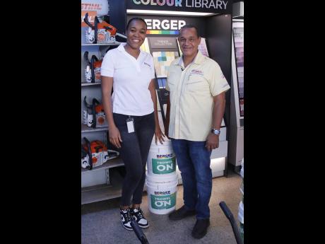 Credit: Contributed Asheaka James (left), trade marketing manager at BPJL, shares lens time with John Groves, managing director of Impact Industrial, at the first stop of the Trowel-On Roadshow in Mandeville, Manchester.