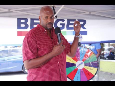 Credit: Contributed George Duhaney, technical lead at BPJL, keeps the audience engaged while explaining the features of the Trowel-On product during the Mandeville, Manchester leg of the roadshow.