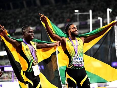Jamaica’s Oblique Seville (left) and Kishane Thompson celebrate their one-two finish in the men’s 100 metres final at the World Athletics Championships inside the Japan National Stadium in Tokyo, Japan on Sunday. Seville won in 9.77 seconds, while Thompson clocked 9.82 for second. The United States’ Noah Lyles was third in 9.89.