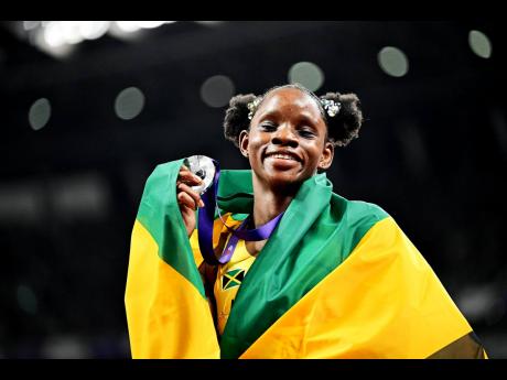 Tina Clayton celebrates winning the silver medal and a personal best 10.76 seconds in the women’s 100m final on Day 2 of the World Athletics Championships at the Japan National Stadium in Tokyo, Japan on Sunday.