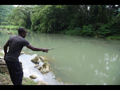 Credit: Ian Allen With rod in hand, Rohan Malcolm’s fishing trek is a tradition rooted deep in Kent Village.