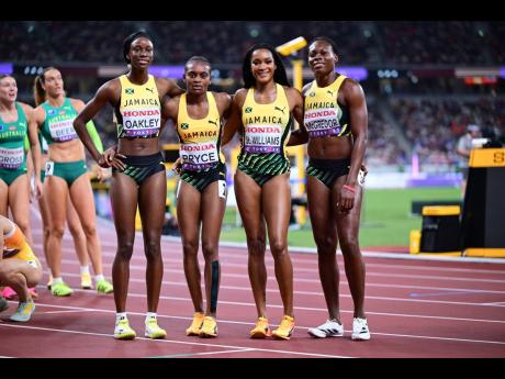 Credit: Gladstone Taylor/Multimedia Photo Editor From left: Jamaica's 4x400-metre women, Dejanea Oakley, Nickisha Pryce, Stacey-Ann Williams, and Roneisha McGregor paint a relaxed picture after winning their World Athletics Championships heat in Tokyo, Japan today.