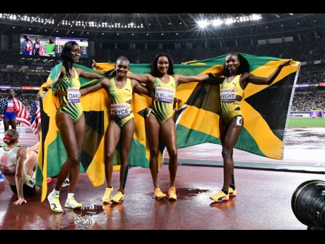 Credit: Gladstone Taylor/Multimedia Photo Editor Jamaica's 4x400-metre women, from left: Dejanea Oakley, Nickisha Pryce, Stacey-Ann Williams, and Andrenette Knight celebrate the silver medal they won at the World Athletics Championships. The Jamaicans clocked 3:19.25.