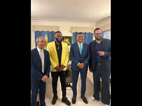 Credit: Contributed Prime Minister Dr Andrew Holness (second right) and Deputy Prime Minister Dr Horace Chang (left) take a pic with TikTok creators Karlando ‘Bad Sekki’ Bailey (second left) and Reuben Hussey at Jamaica House.