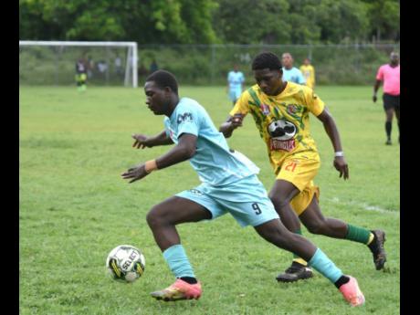Credit: Ashley Anguin Lacovia High’s Tyraun Bembridge (left) moves clear of B.B. Coke High’s Dimario Nephew during their daCosta Cup Zone E match at Lacovia on Saturday, September 27, 2025.
