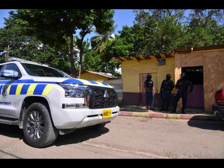Credit: Antoine Lodge Members of the Jamaica Constabulary Force on the scene maintaining order.