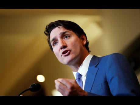 Credit: AP Photos Trudeau
