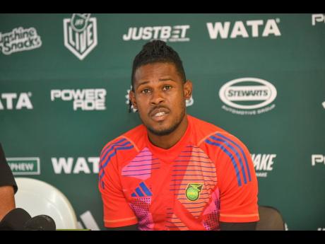 Credit: Matthew McKoy Reggae Boyz captain and goalkeeper Andre Blake speaking at the pre-game press conference at the National Stadium yesterday.