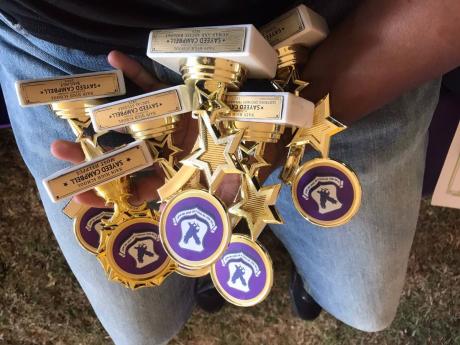 Credit: Contributed Sayeed shows off some of his awards.