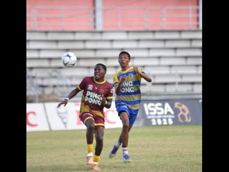 Credit: Ashley Anguin Maggotty High’s Dante Blair (left) and Rusea’s High’s Roshawn Dillion challenge for the ball during their Group one football match in the second round of the ISSA daCosta Cup at Montego Bay Sports Complex on Saturday, October 11.