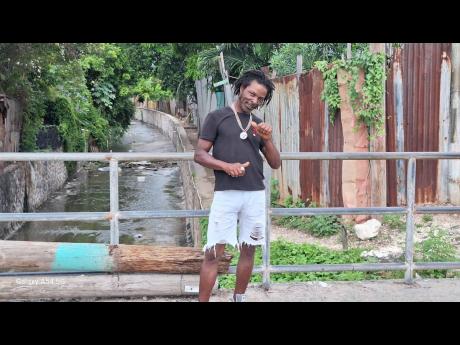 Credit: Almando Smith Sutherland said he has his tube ready to assist any poor soul who falls into the Sandy Gully as Tropical Storm Melissa is expected to dump heavy rain on the island.