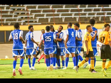 Credit: Matthew McKoy Mount Pleasant Football Academy players celebrating a goal during the Concacaf Caribbean Cup football match against O & M Football Club. The St Ann team romped to a 5-1 win over Trinidad and Tobago’s Defense Force at the Hasely Crawford Stadium in Trinidad yesterday.