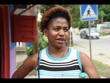 Credit: Ian Allen Yashima Thompson is ready to party in the rain.