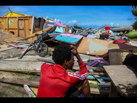 Credit: Antoine Lodge A fisherman from Salem, St Ann, sits amid the rubble, his head buried in his hands, as he surveys the devastation left behind at the Salem fishermen’s beach following the passage of Hurricane Melissa, which swept across the island on Tuesday.
