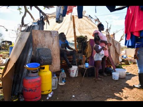 Jermaine Tomlinson’s family now endures the harsh aftermath of Hurricane Melissa, living under a tattered tarpaulin in Farm, Westmoreland.