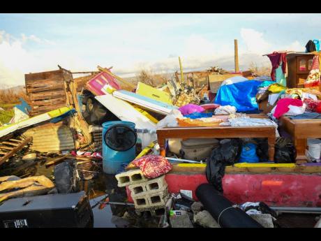 Devastation on display – the remains of residents’ belongings scattered along Crane Road, St Elizabeth, following the passage of Hurricane Melissa.